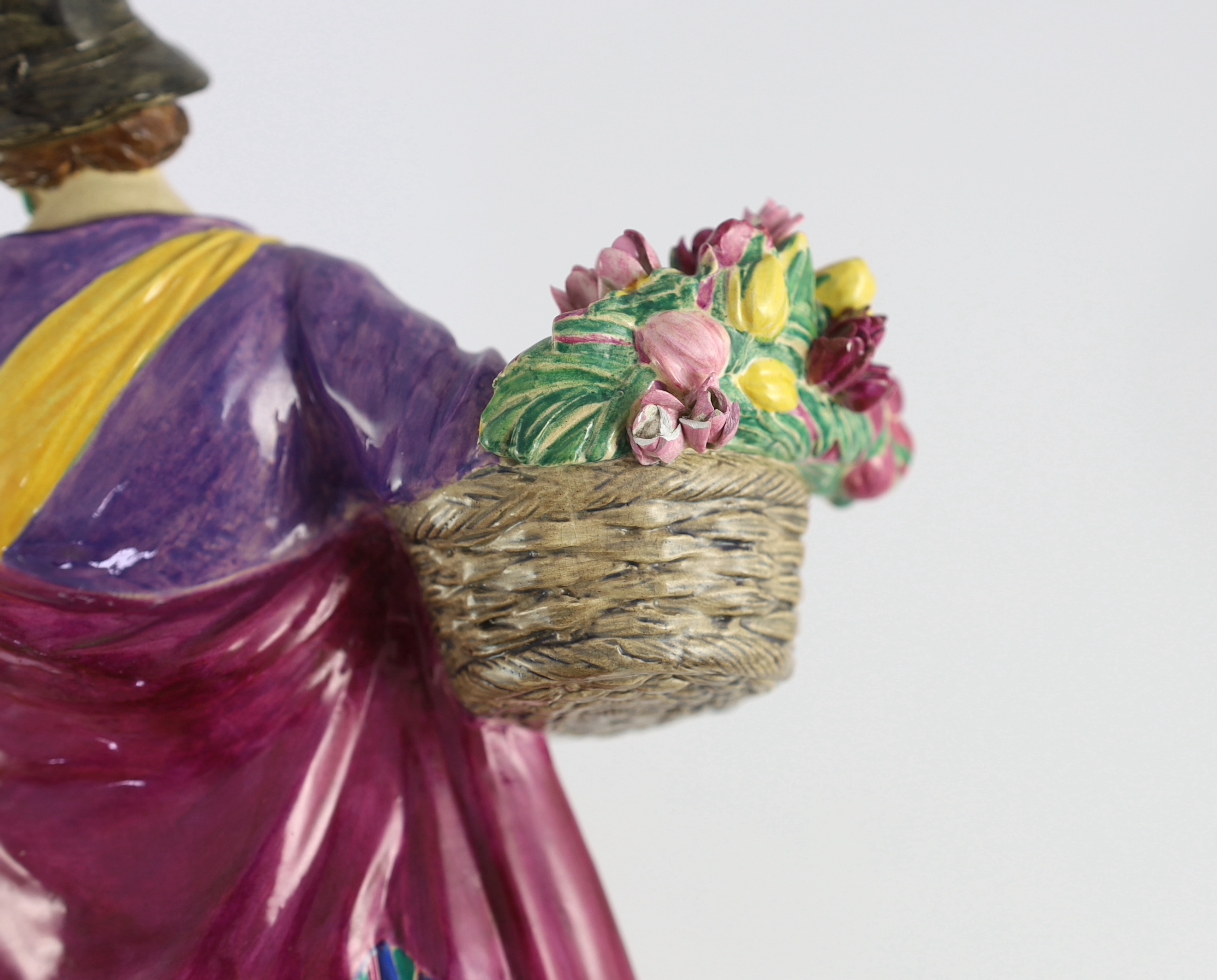 Charles Vyse (1882-1971) - a Chelsea Pottery figure, 'The Tulip Woman', the circular underside inscribed with monograms CV, Chelsea and dated 1924, 26cm high